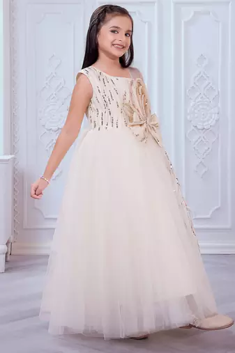 cream net gown with sequins and oversized bow