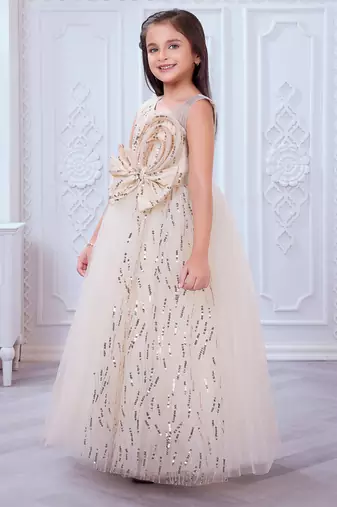 cream net gown with sequins and oversized bow
