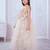 cream net gown with sequins and oversized bow