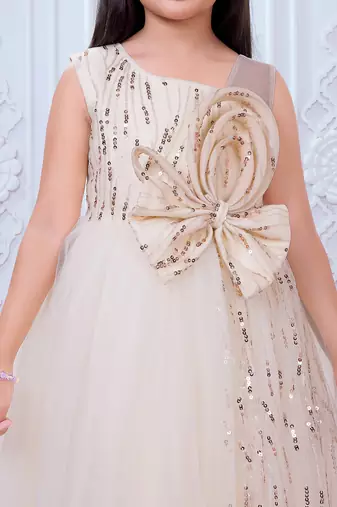 cream net gown with sequins and oversized bow