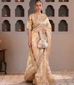 Gold embroidered pure tissue silk saree with blouse