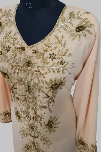 Elegant beige georgette kaftan gown with golden zari work With hijab.