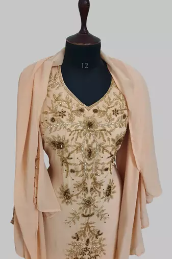 Elegant beige georgette kaftan gown with golden zari work With hijab.