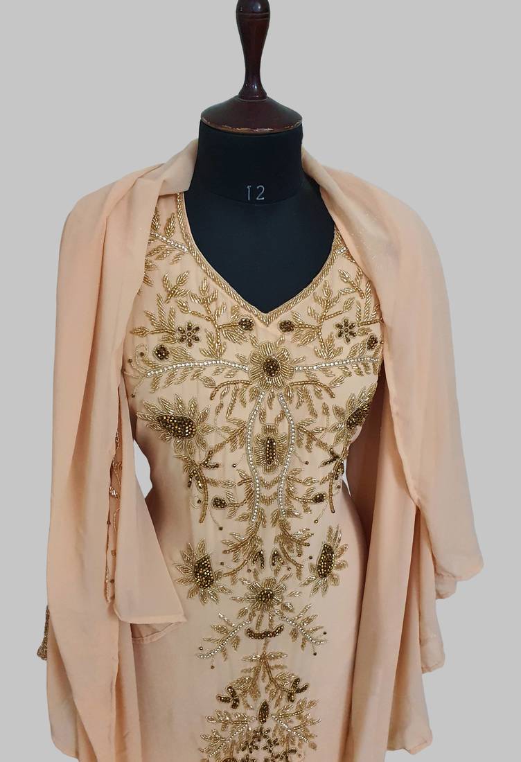 Elegant beige georgette kaftan gown with golden zari work With hijab.