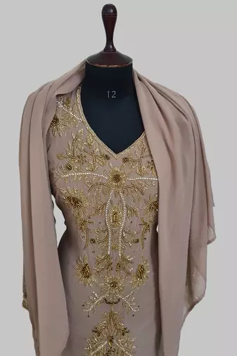 Elegant Chiku georgette kaftan gown with golden zari work With hijab.