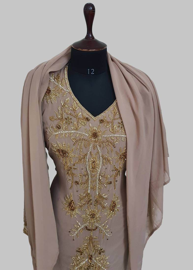 Elegant Chiku georgette kaftan gown with golden zari work With hijab.