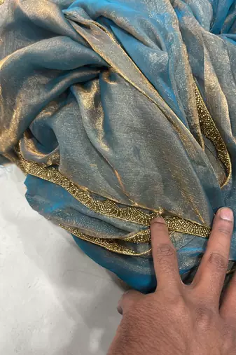 Sky blue color fendy chiffon saree with running blouse