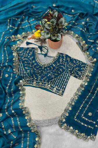 teal satin SIlk Blnd saree with embroidered blouse