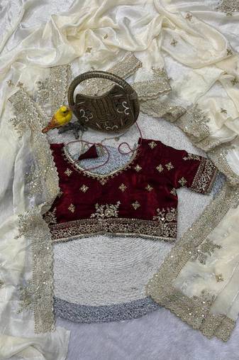 white satin designer saree with maroon embroidered blouse