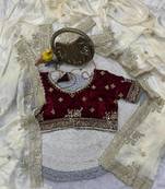 white satin designer saree with maroon embroidered blouse