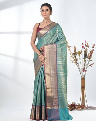 teal brocade saree with intricate borders 1