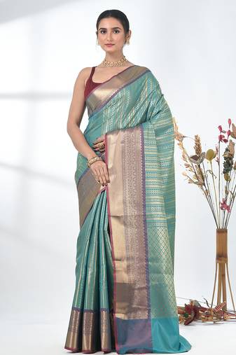 teal brocade saree with intricate borders