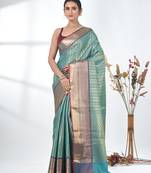 teal brocade saree with intricate borders