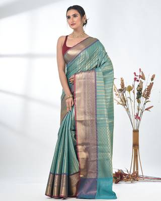 teal brocade saree with intricate borders 2