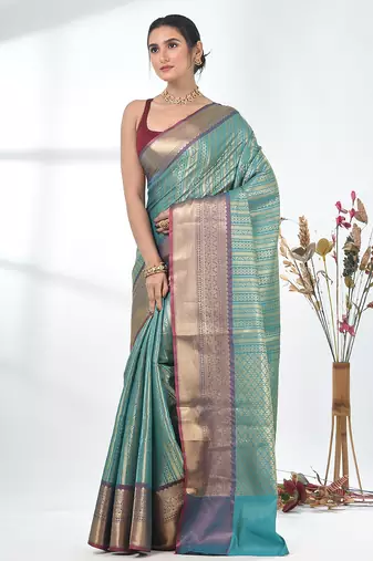 teal brocade saree with intricate borders