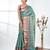 teal brocade saree with intricate borders