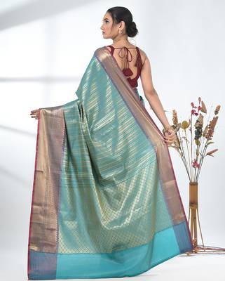 teal brocade saree with intricate borders 3