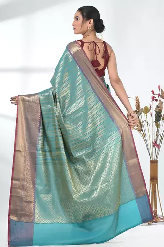 teal brocade saree with intricate borders