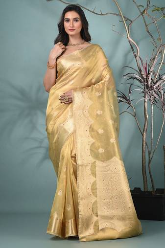 golden tissue saree with intricate embroidery and scalloped border
