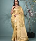 golden tissue saree with intricate embroidery and scalloped border