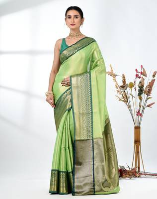 green brocade saree with intricate borders 1
