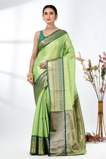 green brocade saree with intricate borders