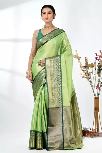 green brocade saree with intricate borders