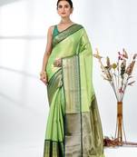 green brocade saree with intricate borders