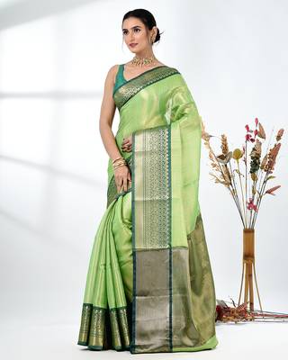 green brocade saree with intricate borders 2