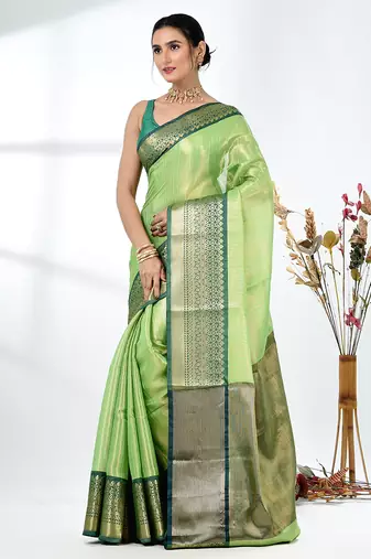 green brocade saree with intricate borders