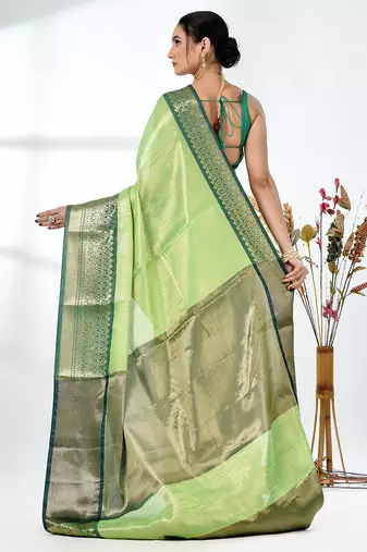 green brocade saree with intricate borders