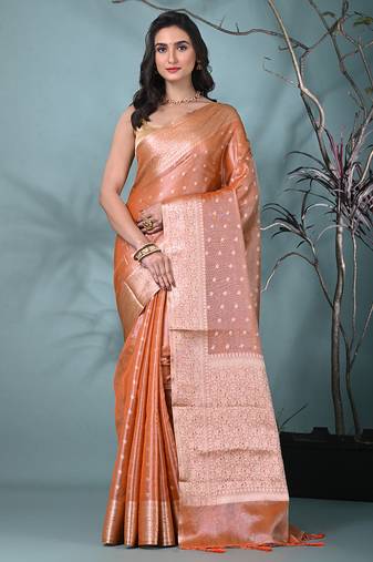 elegant orange tissue saree with intricate border