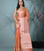 elegant orange tissue saree with intricate border