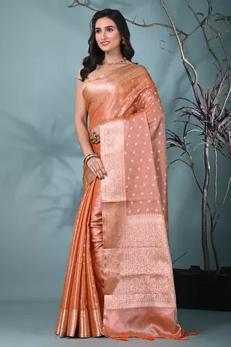 elegant orange tissue saree with intricate border