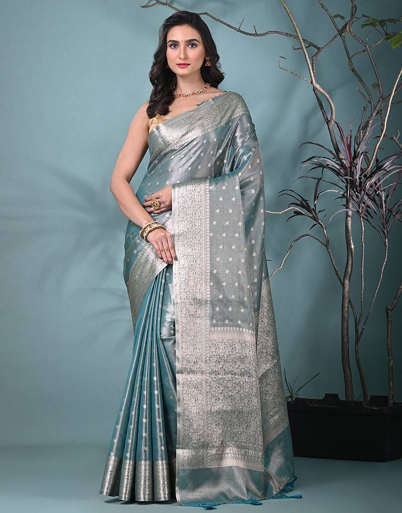 elegant teal tissue saree with intricate border