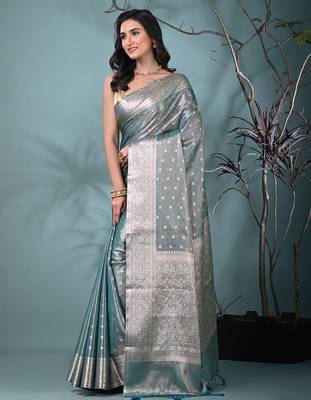 elegant teal tissue saree with intricate border 2