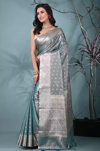 elegant teal tissue saree with intricate border