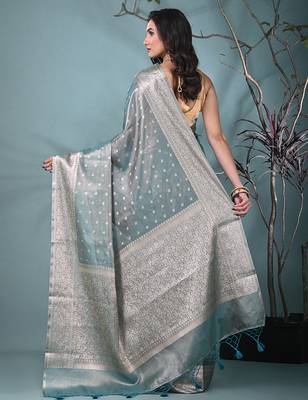 elegant teal tissue saree with intricate border 3