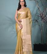 elegant yellow tissue saree with intricate border