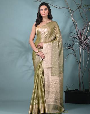 elegant sap green tissue saree with intricate border 1