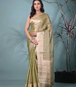 elegant sap green tissue saree with intricate border
