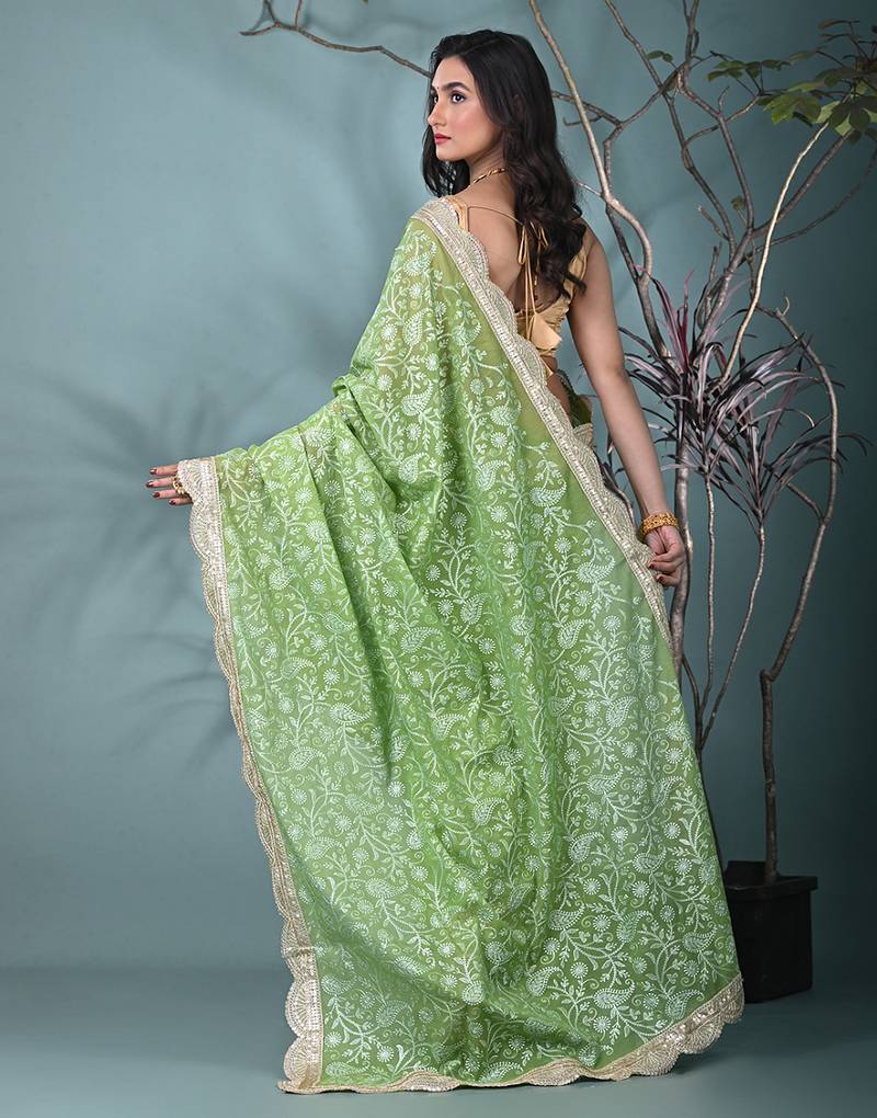green chanderi silk blend saree with embroidered floral design