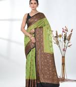 green georgette saree with red and gold border