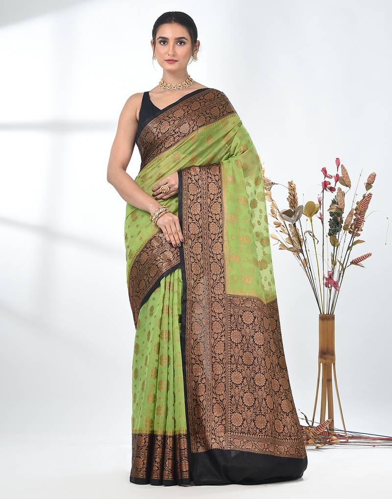 green georgette saree with red and gold border