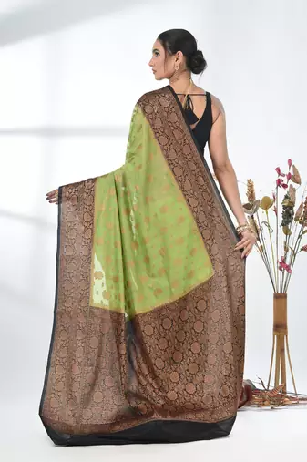 green georgette saree with red and gold border