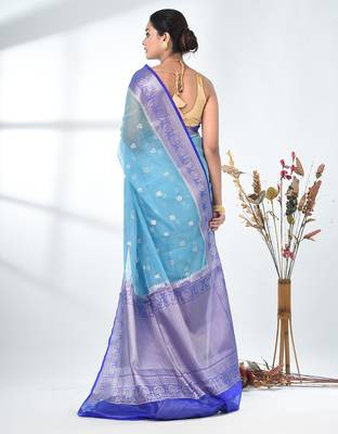 sky blue organza saree with floral motifs and blue border 3