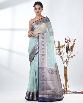 pastel blue organza saree with floral motifs and blue border 1
