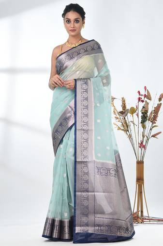pastel blue organza saree with floral motifs and blue border