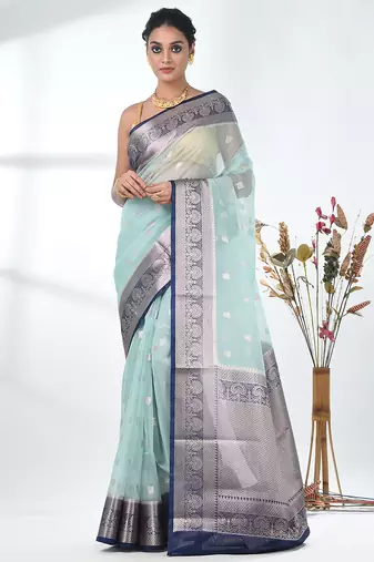 pastel blue organza saree with floral motifs and blue border