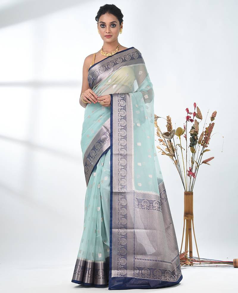 pastel blue organza saree with floral motifs and blue border